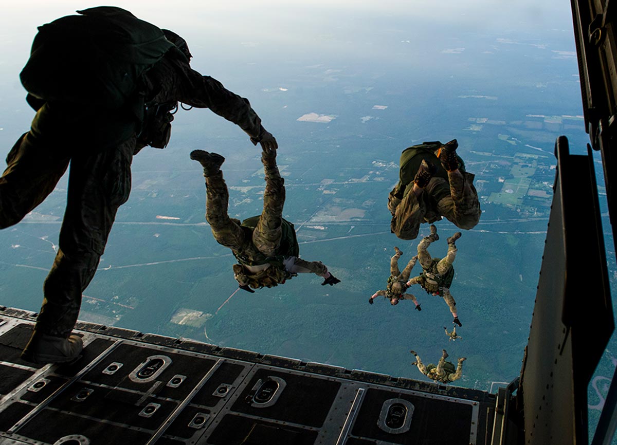 US Army military paratroopers jumping